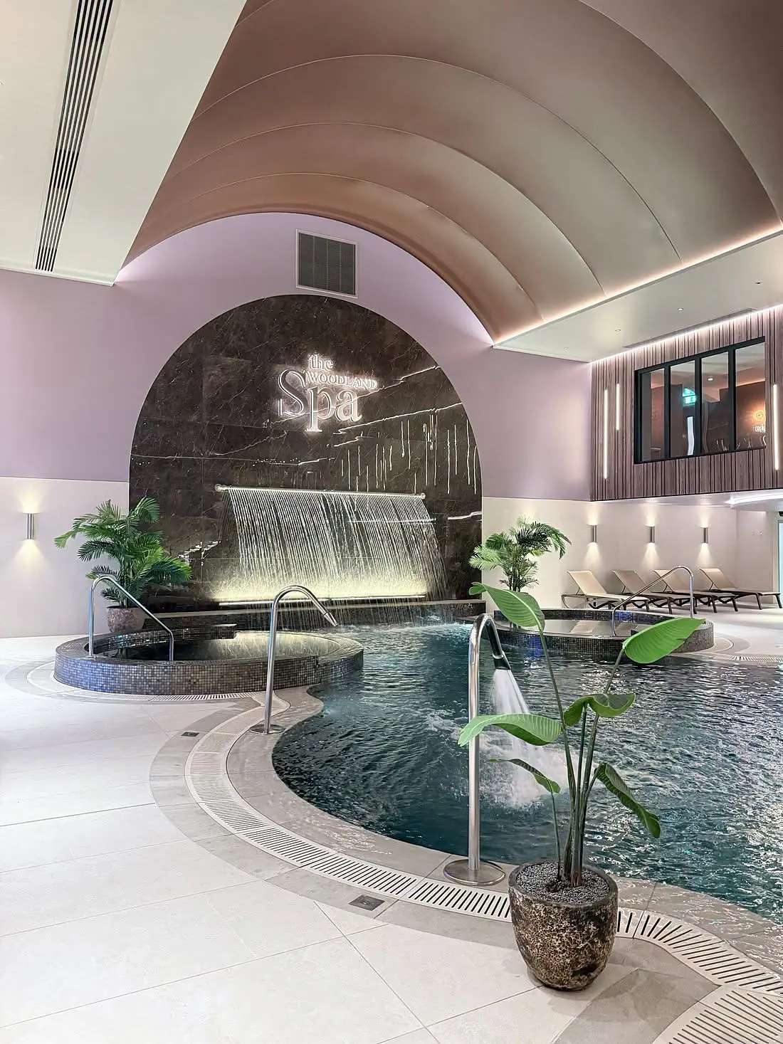 Hydrotherapy pool and marble waterfall wall at The Woodland Spa