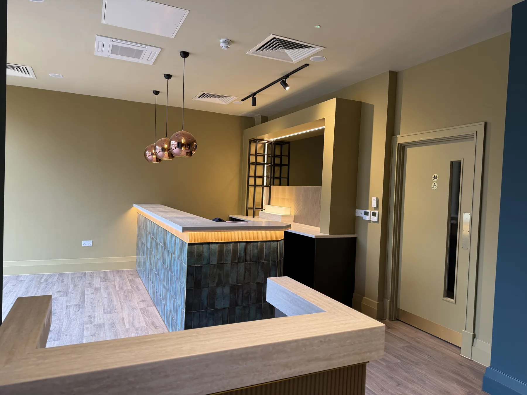 Bar with a fluted timber front and pale stone top