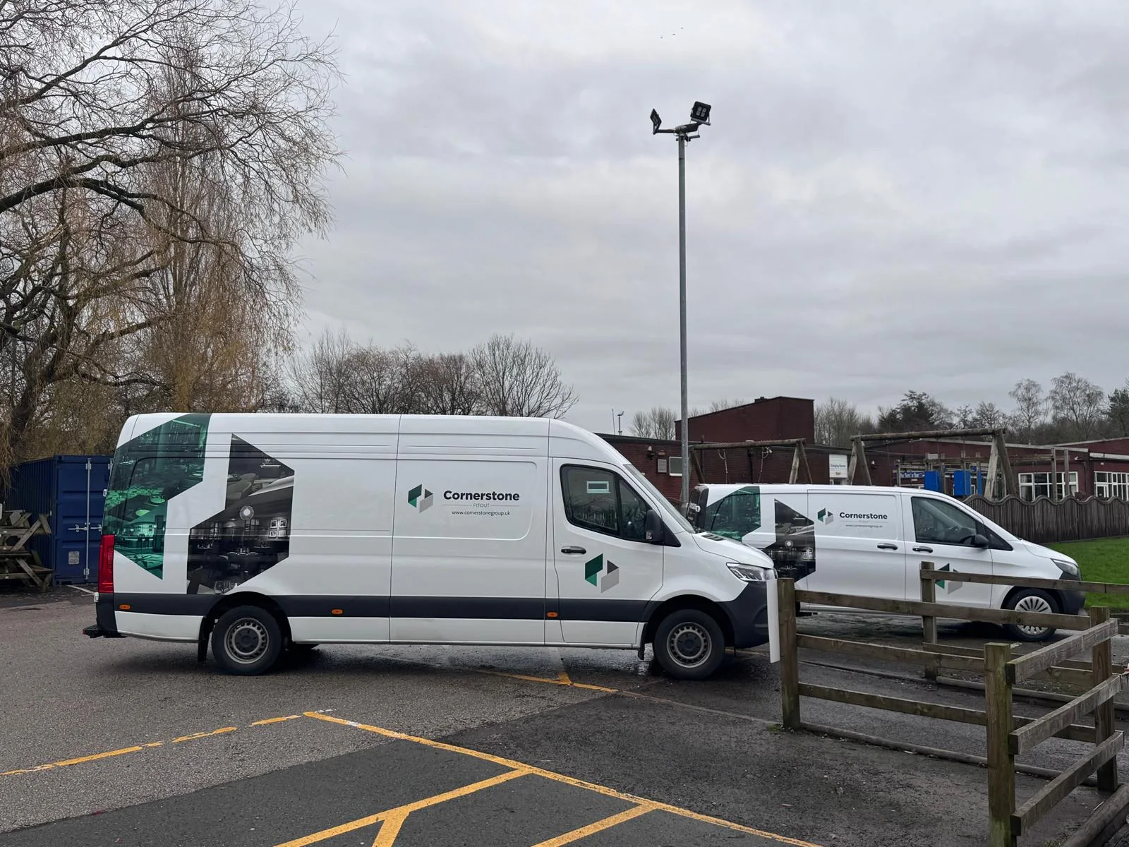 Cornerstone Fitout vans in the car park at Preston Grasshoppers