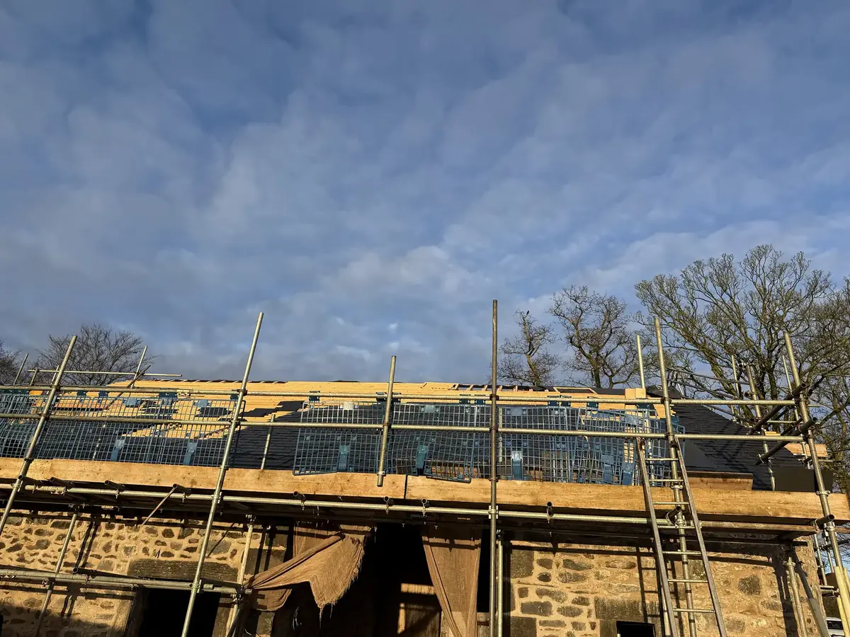 New timber roof structure on original stone walls