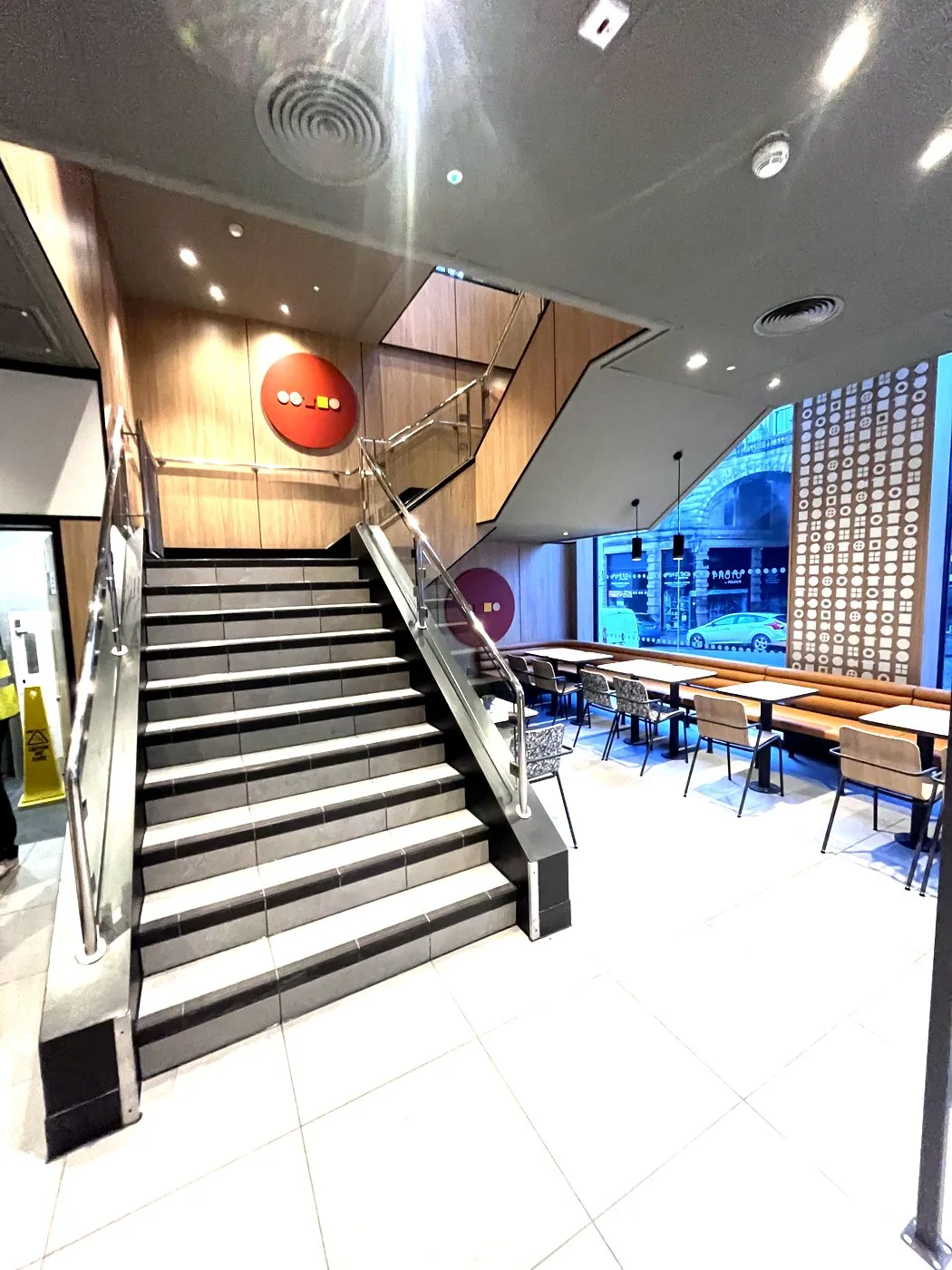 Staircase, tiled treads and glass balustrade