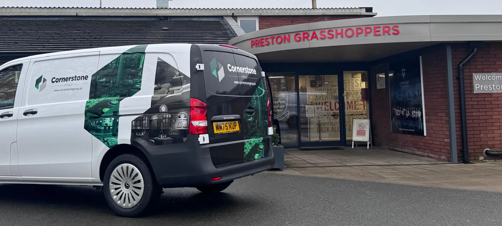 Cornerstone Fitout van in company livery outside the entrance to Preston Grasshoppers