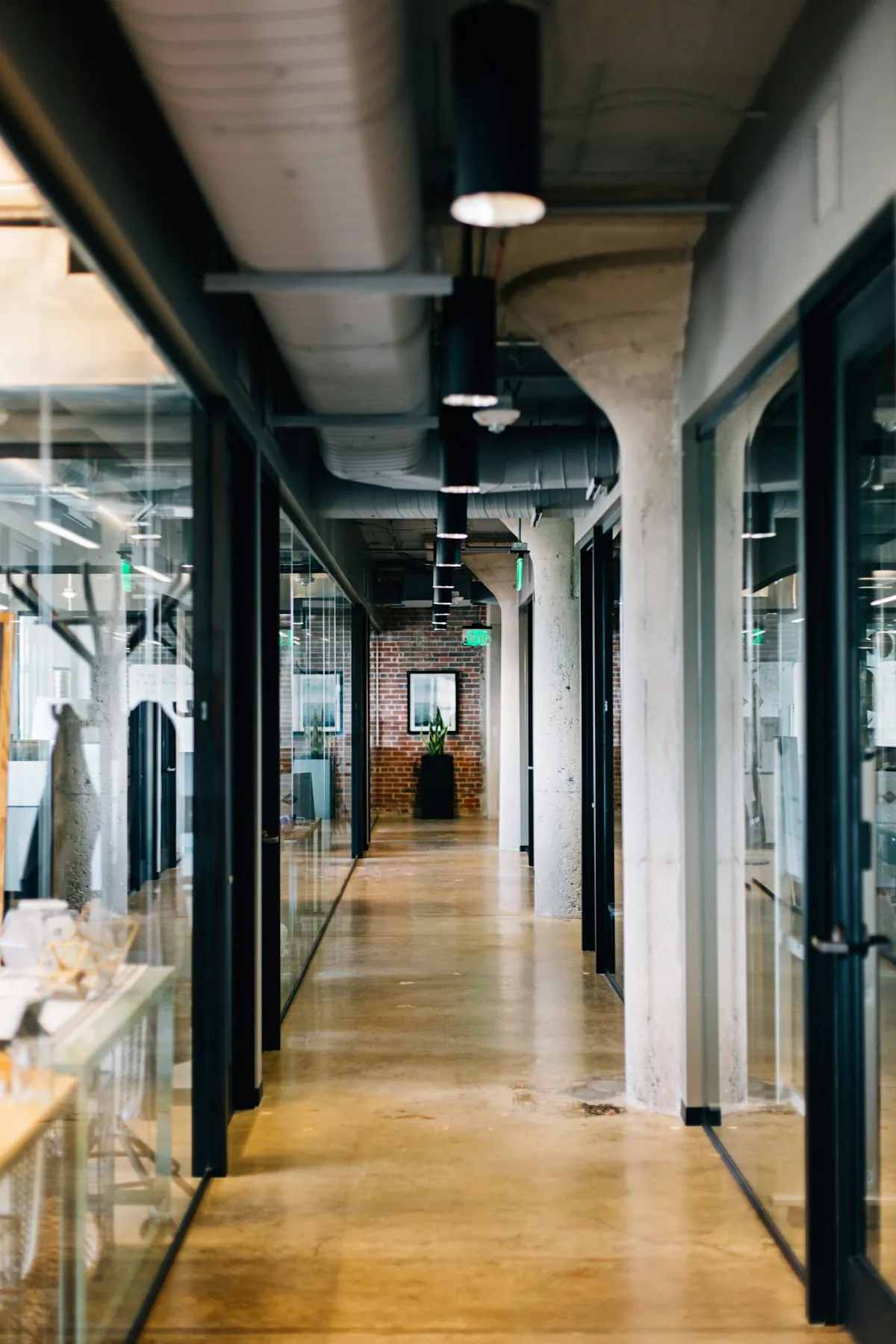 Modern office corridor with glazed partitions