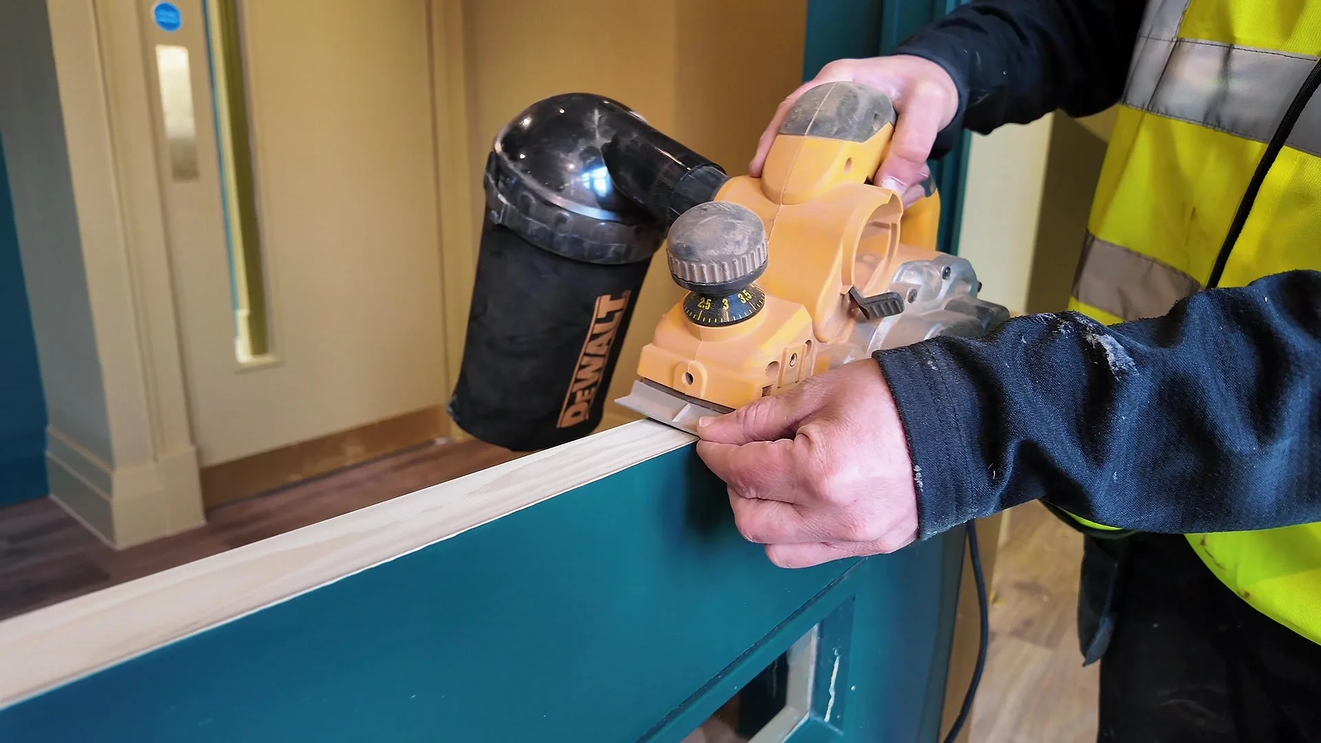 Planing the edge of a fire door so it closes cleanly in its frame