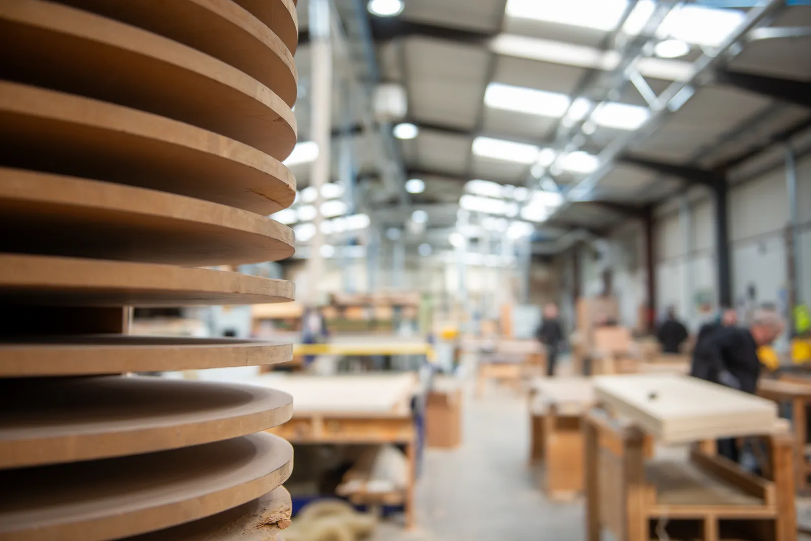 Stacked timber components in the Cornerstone joinery workshop