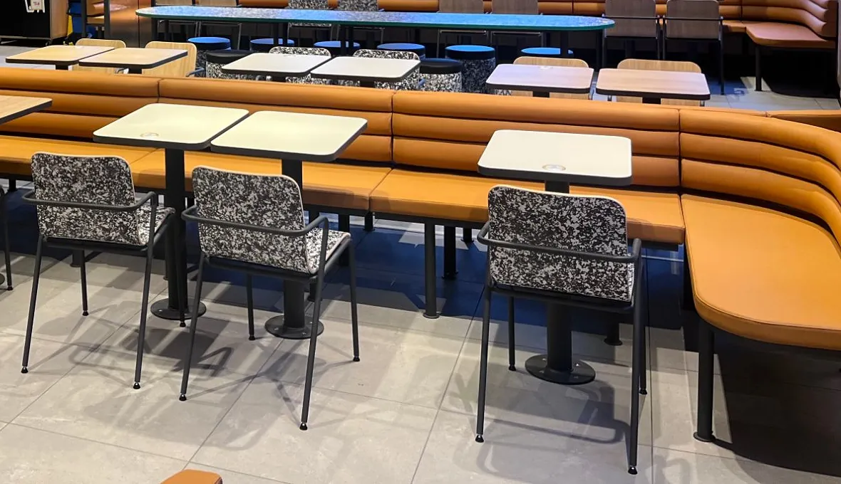 Curved banquettes, joinery and patterned chairs