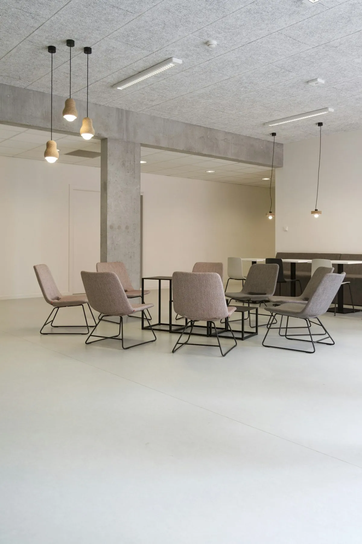 Office breakout area with pendant lighting