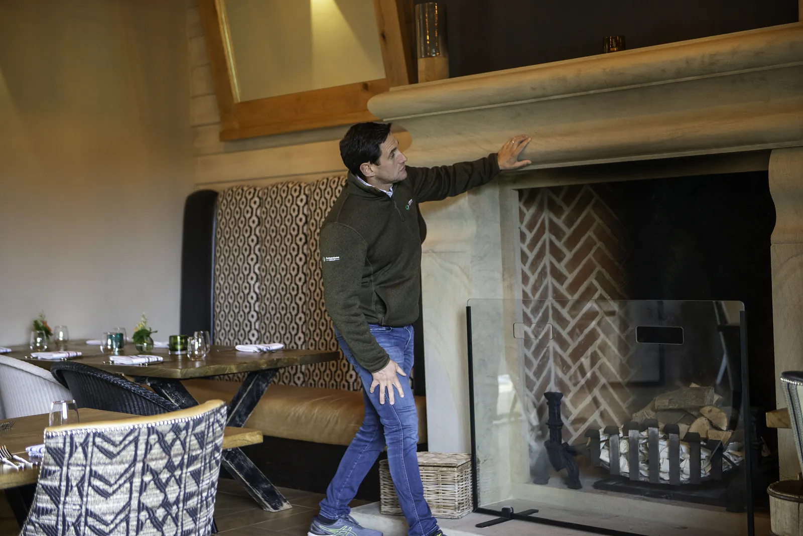 Restored stone fireplace in the dining room