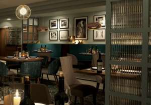 A view inside a restaurant with a blue and grey theming, and eclectic decorations, before opening.